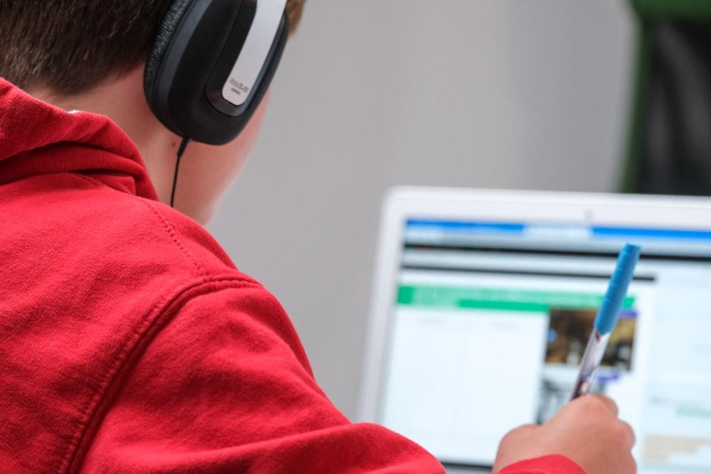 A child attending a live online class on a laptop